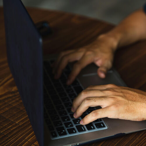 Hands on a computer keyboard