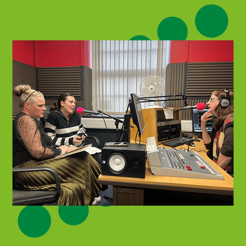Three people talking in a radio studio