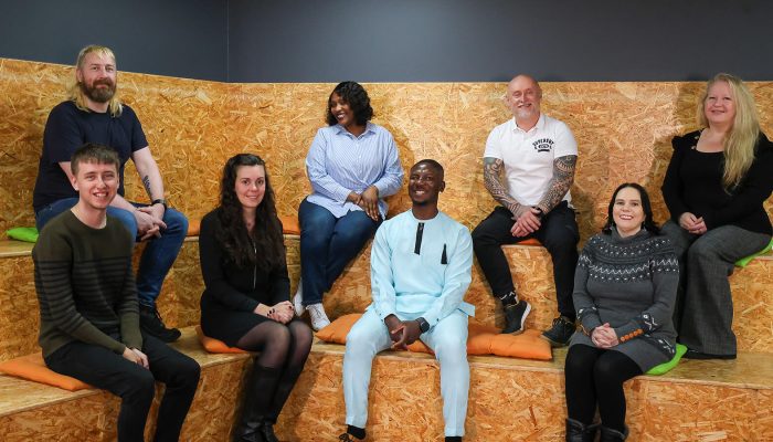 Salix Homes Customer Committee, a group of men and women sat together