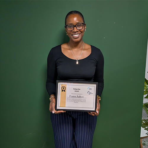 A woman holding a certificate