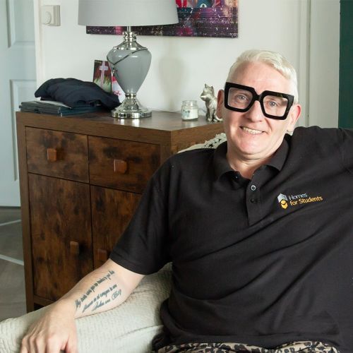 A man sat in his living room